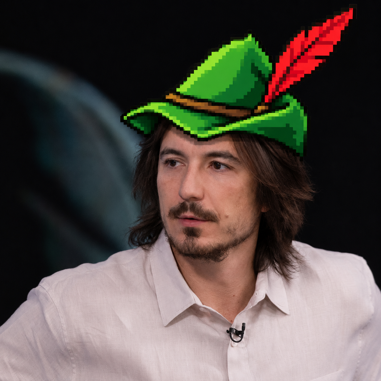 Man wearing the pixel green feathered $BYCOCKET hat
